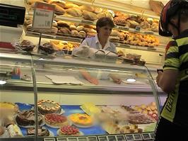 Gavin buys some pastries from the patisserie outside Migros supermarket, Laufen